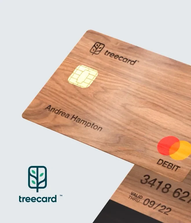 Two Treecard wooden debit cards, one showing an embedded chip and a Mastercard logo.